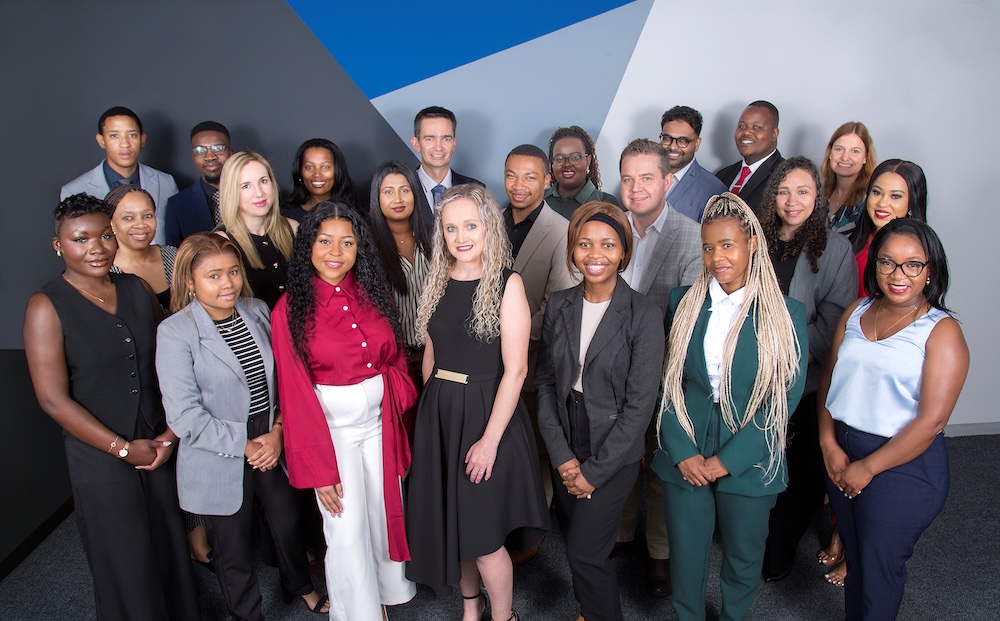 Diverse team posing in formal attire